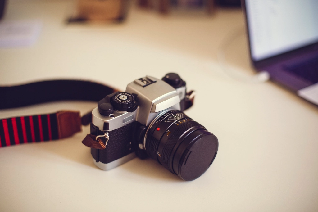 Camera resting on a table in soft natural light