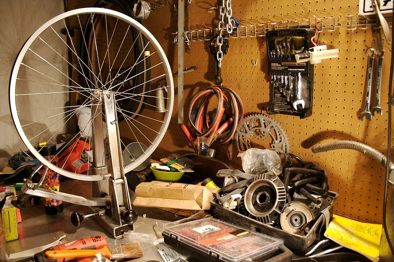 Home garage workshop with tools hanging on a pegboard