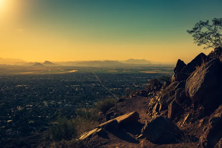 View from Camelback Mountain over residential neighborhoods of Phoenix, Arizona at sunset